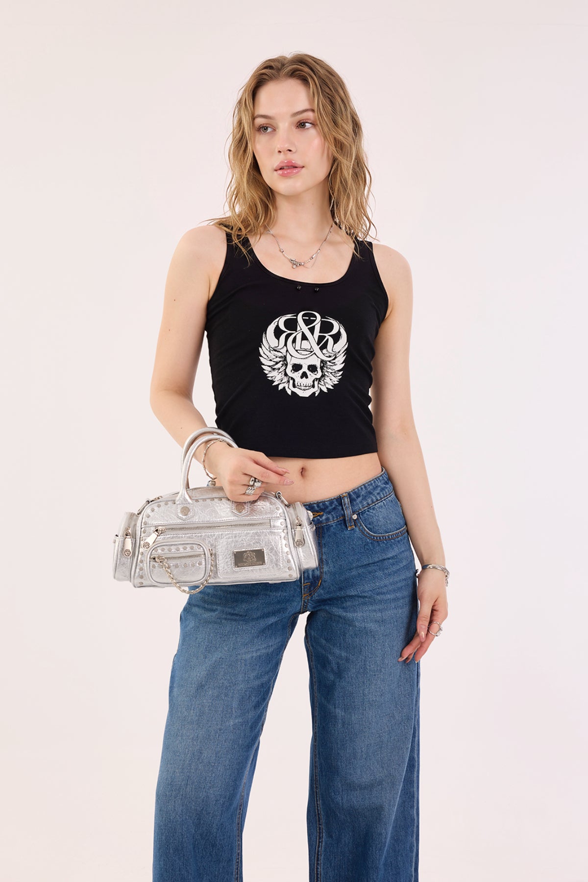 Rock & Republic Studded Mini Boston Bag in Silver PU styled on model showing handheld proportions and boston silhouette.