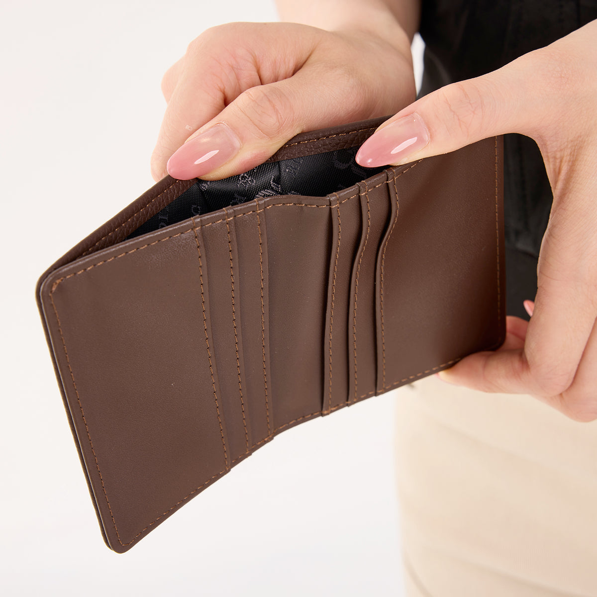 Rock & Republic Studded Border Flap Wallet in Coffee PU interior view showing card slots and bifold wallet silhouette.