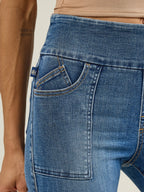 Front detail of Rock & Republic Women's Fever Legging in Last Call showing elastic pull-on waistband and blue RR logo tab.