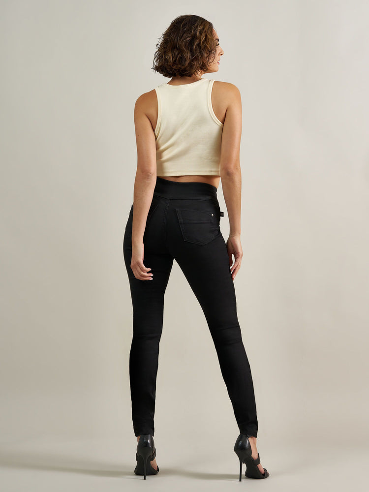 Back view of Rock & Republic Women's Fever Legging in DNA solid black wash showing classic rear pockets and sleek fit.