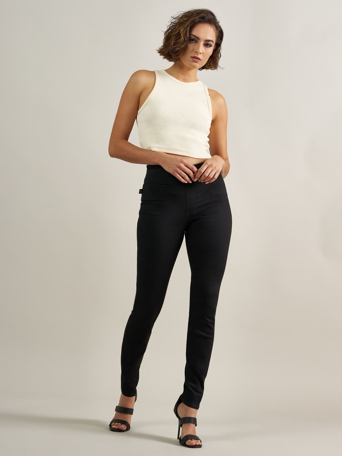 Front view of Rock & Republic Women's Fever Legging in DNA solid black wash showing elastic waistband and sleek fit.