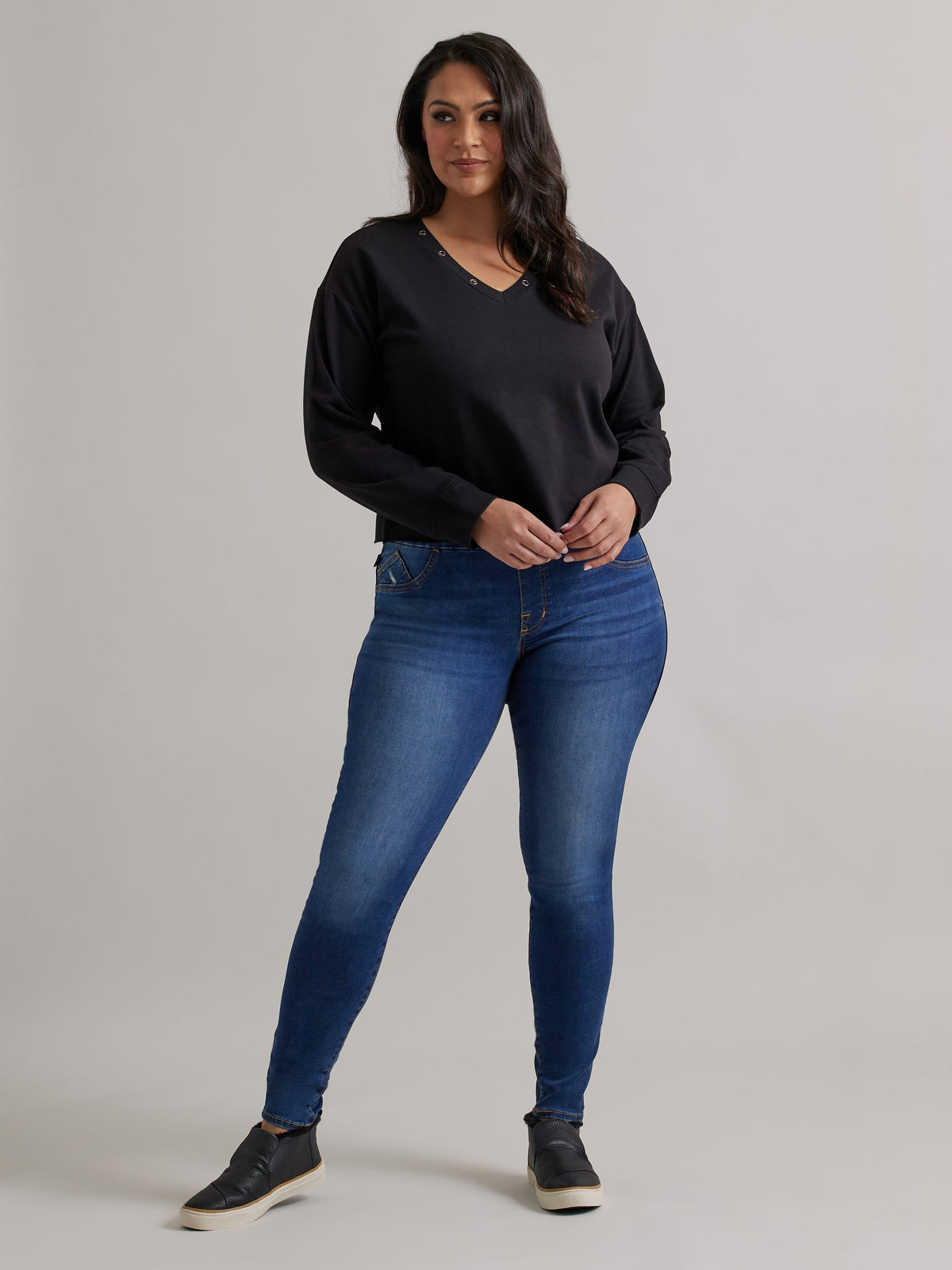 Front view of Rock & Republic Women's Fever Legging in Come Thru on curve model with elastic waistband and sleek fit.