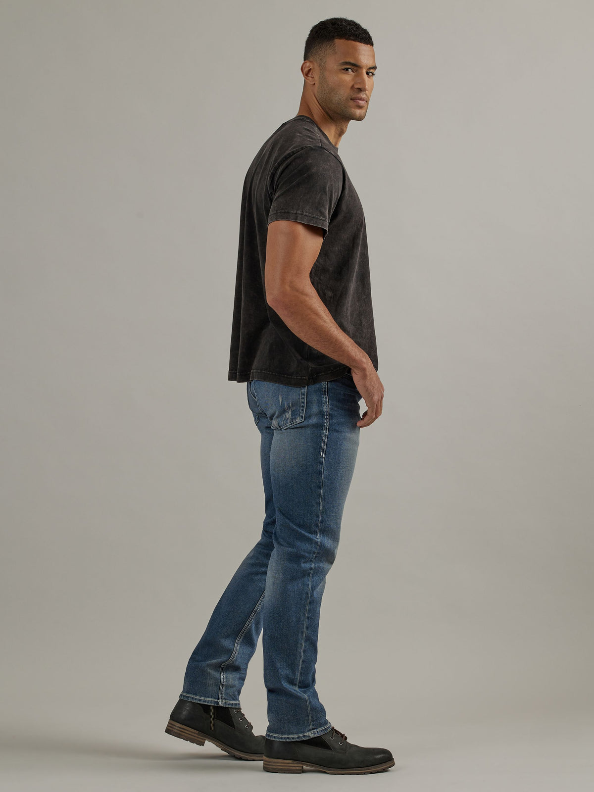 Side profile view of Rock & Republic Neil graffiti straight jeans in Denied highlighting clean straight leg silhouette.