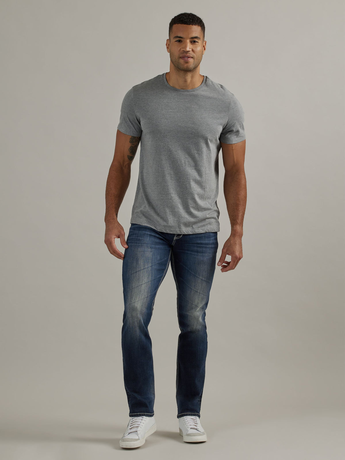 Full front view of Rock & Republic Colburg slim straight jeans in Mad Skills showing slim straight leg and bold stitching.