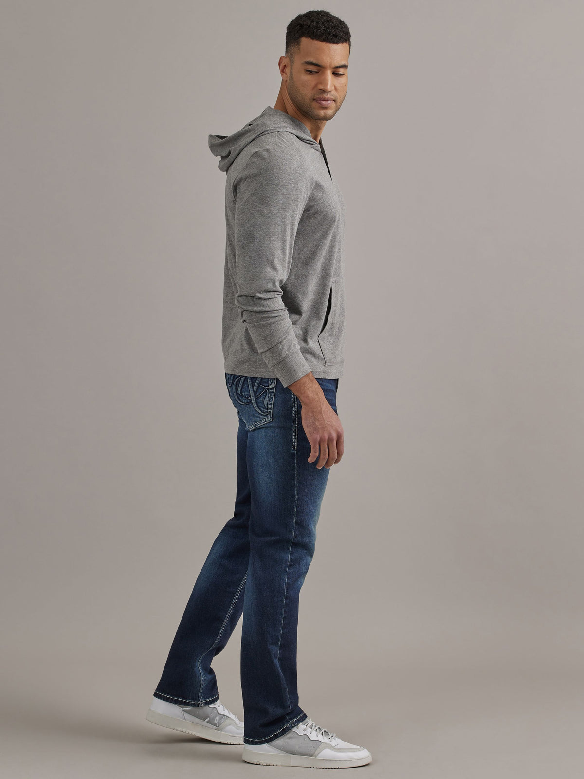 Side profile view of Rock & Republic Grady relaxed straight jeans in On Point highlighting relaxed straight leg fit.