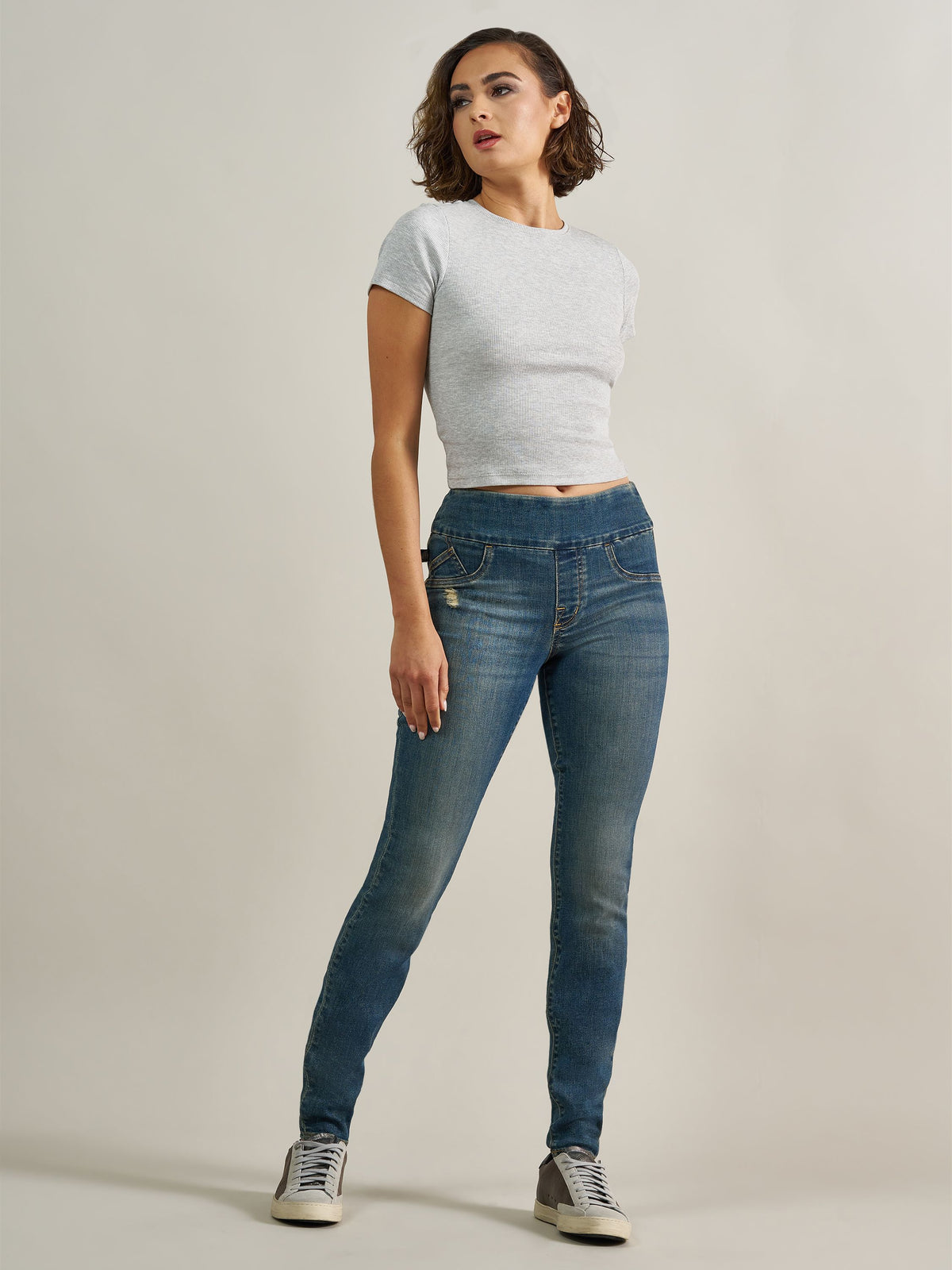 Front view of Rock & Republic Women's Fever Legging in Symptomatic wash showing elastic waistband and distressed details.