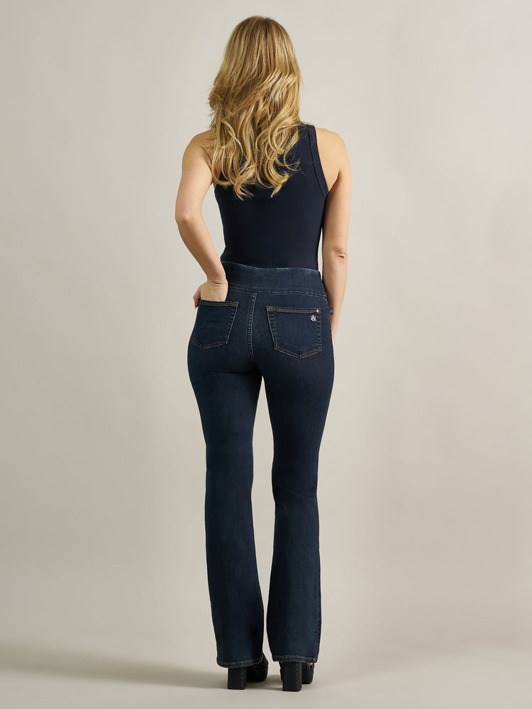 Back full view of Rock & Republic Fever pull-on bootcut jeans in Heart Beat showing rear pockets and bootcut silhouette.