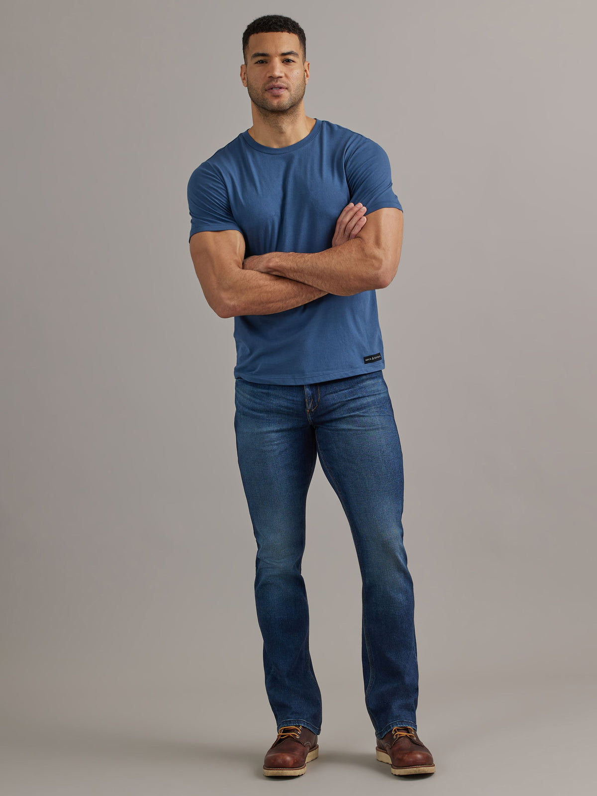 Front full view of Rock & Republic Henlee bootcut jeans in Hall of Fame featuring classic mid-blue wash and whiskering.