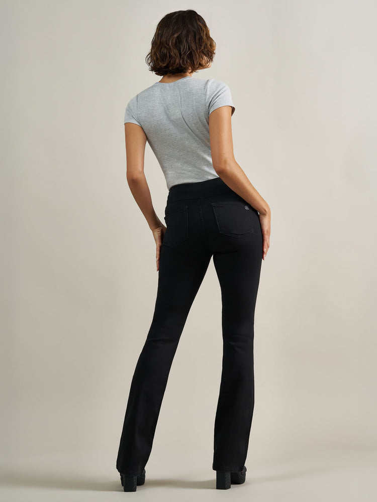 Back full view of Rock & Republic Fever pull-on bootcut jeans in DNA showing flattering rear pockets and flared bootcut hem.