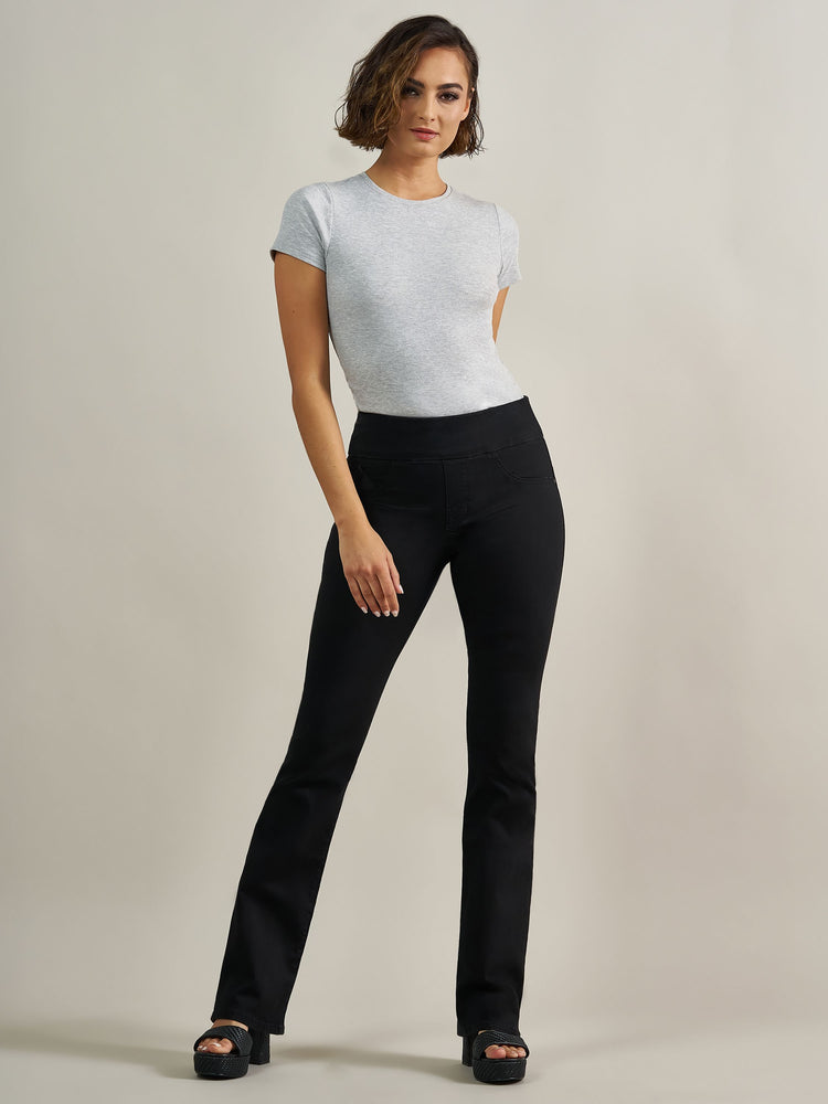 Front full view of Rock & Republic Fever pull-on bootcut jeans in DNA featuring sleek solid black denim and wide waistband.