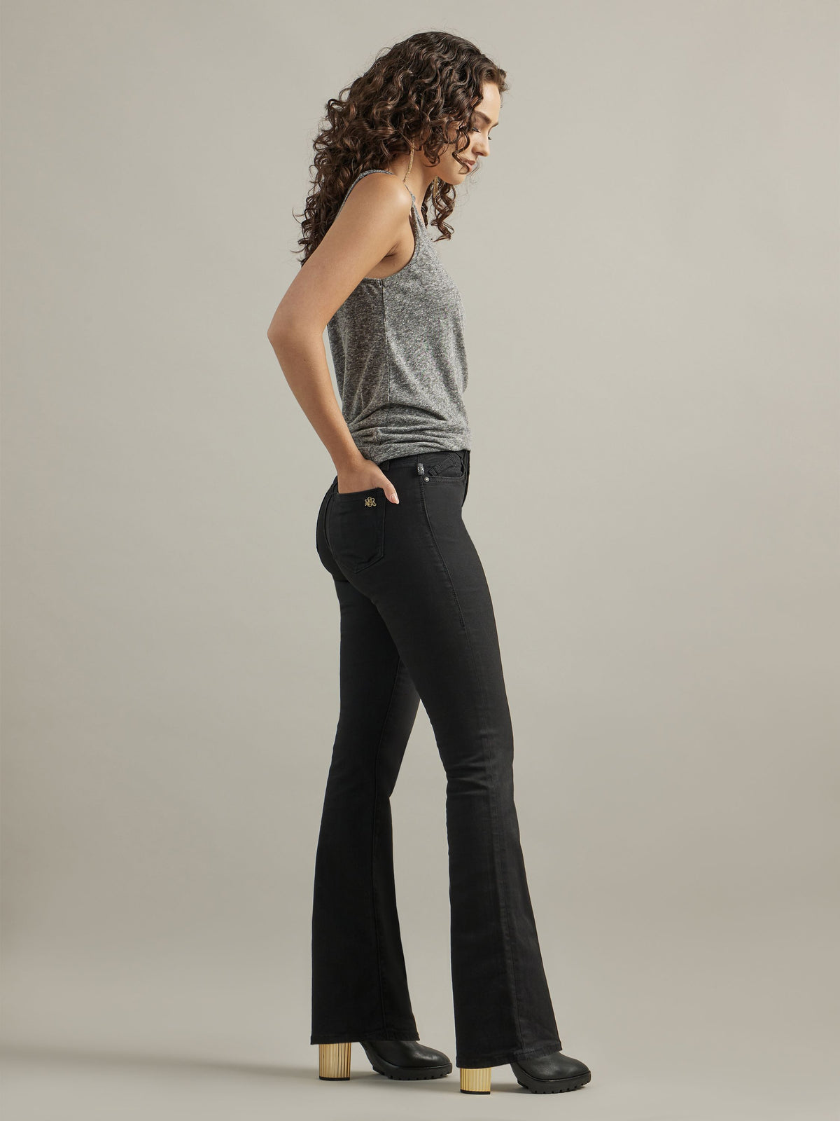 Side profile view of Rock & Republic Kasandra bootcut jeans in DNA highlighting sleek sculpted fit and flare hemline.