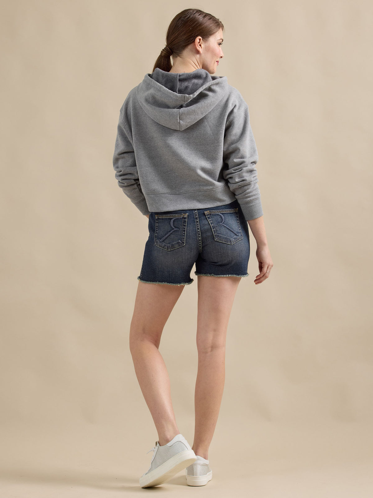 Back view of Rock & Republic Hula Short in It Girl wash featuring signature R-stitched back pockets and raw hems.