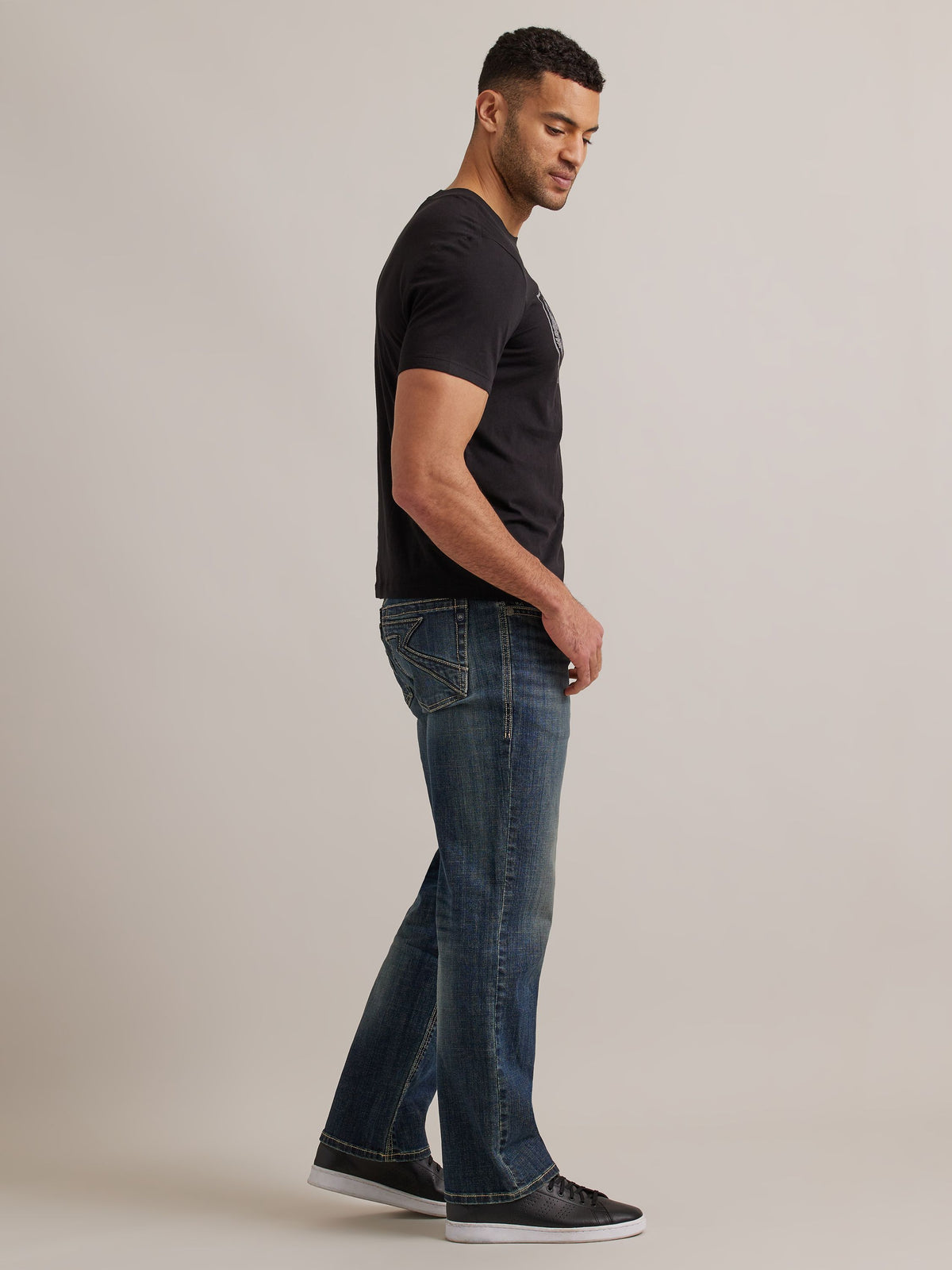 Side profile view of Rock & Republic Grady relaxed straight jeans in Radiator highlighting relaxed straight leg fit.
