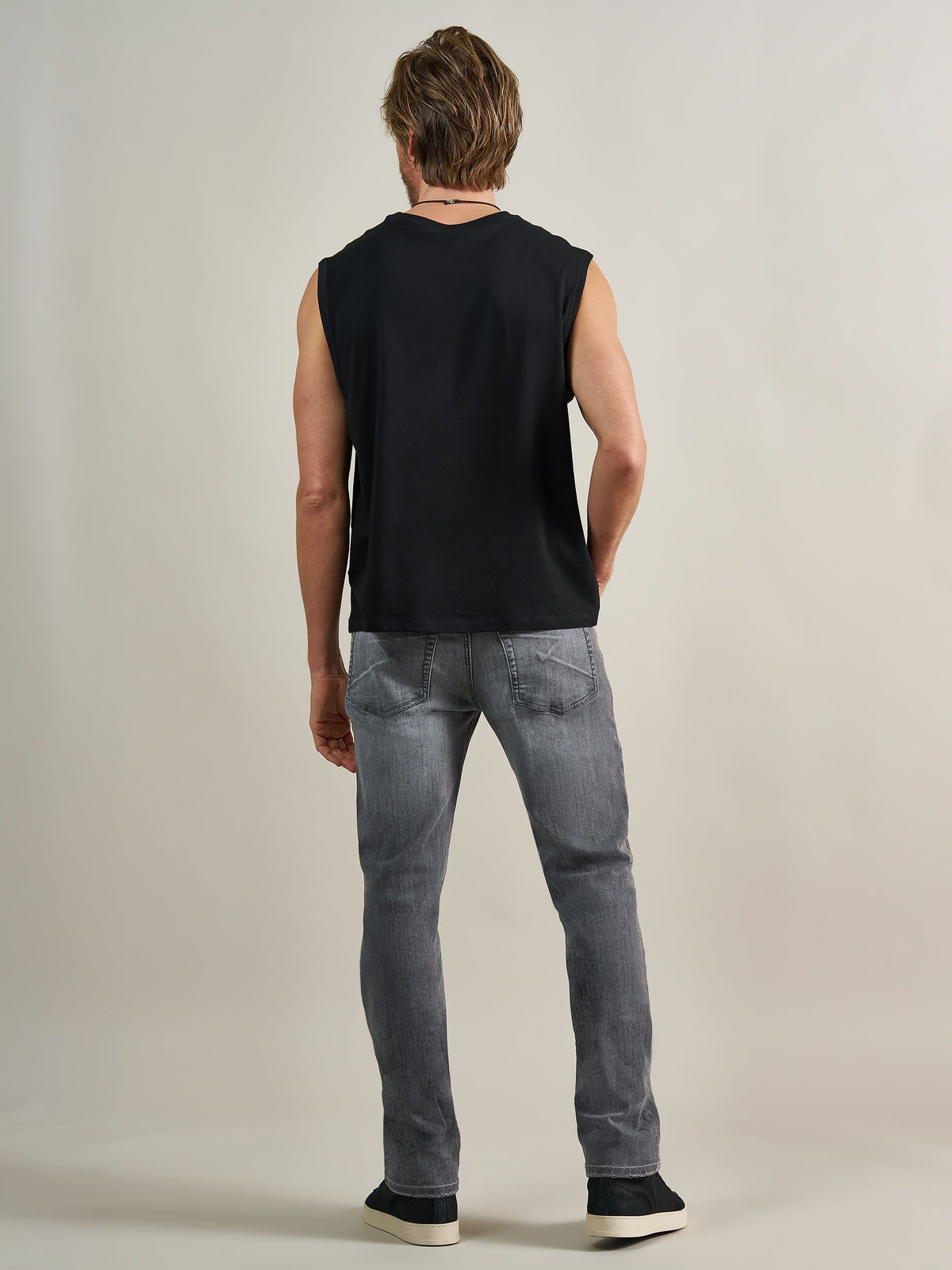 Back full view of Rock & Republic Neil straight jeans in Toner Low showing rear pocket stitching and straight leg fit.