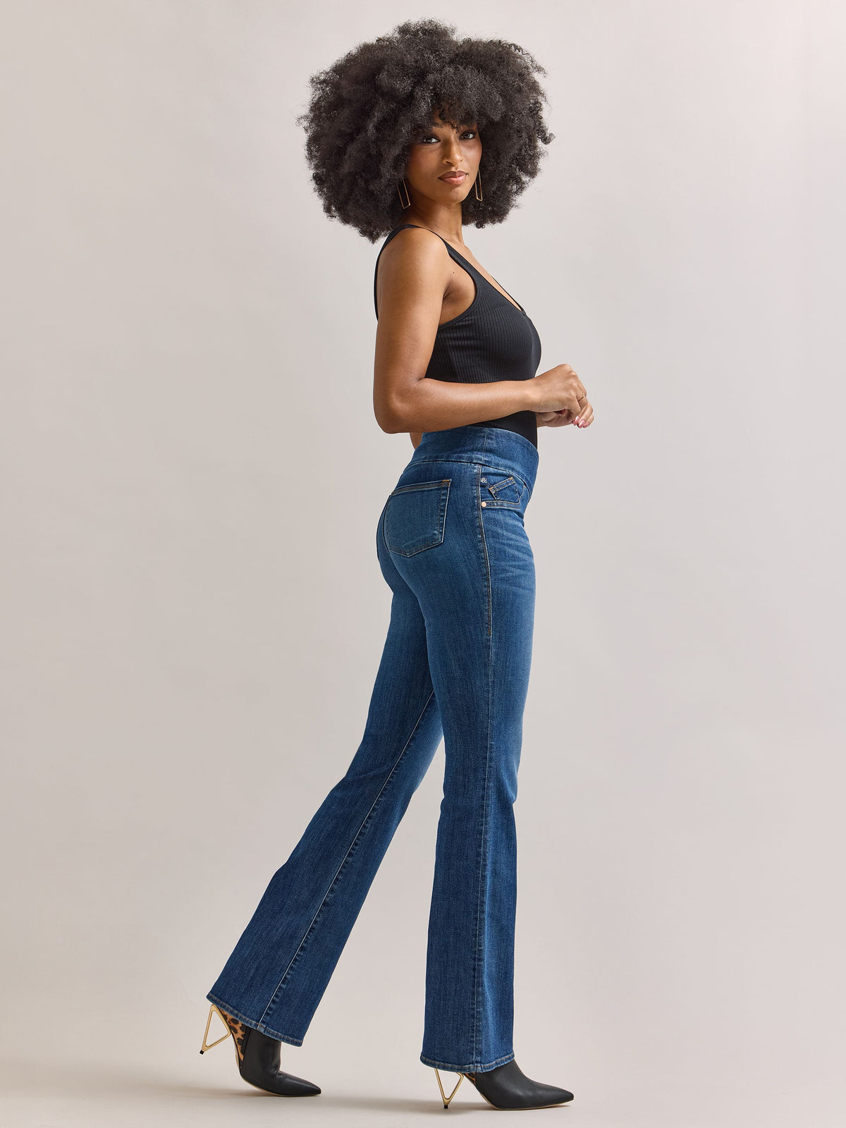 Side profile view of Rock & Republic Fever pull-on bootcut jeans in Heartfelt showcasing sleek fit and bootcut silhouette.