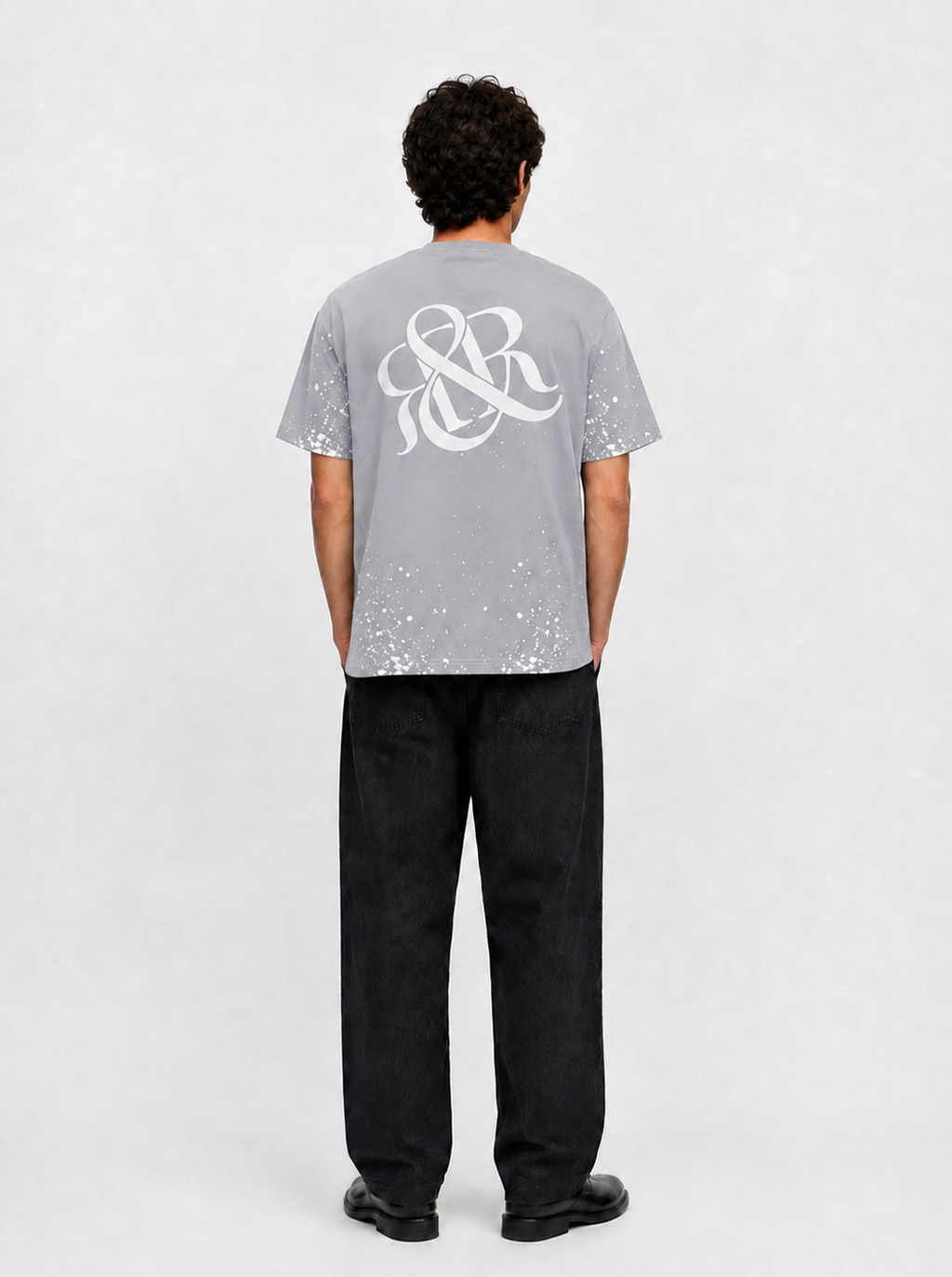 Rock Graphic T-Shirt with Distressed Paint Splatter Detail