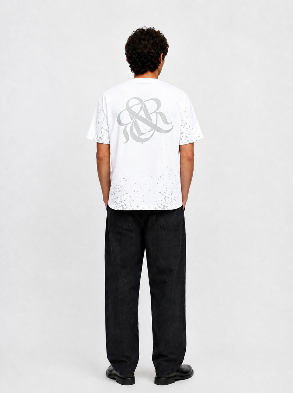 Rock Graphic T-Shirt with Distressed Paint Splatter Detail
