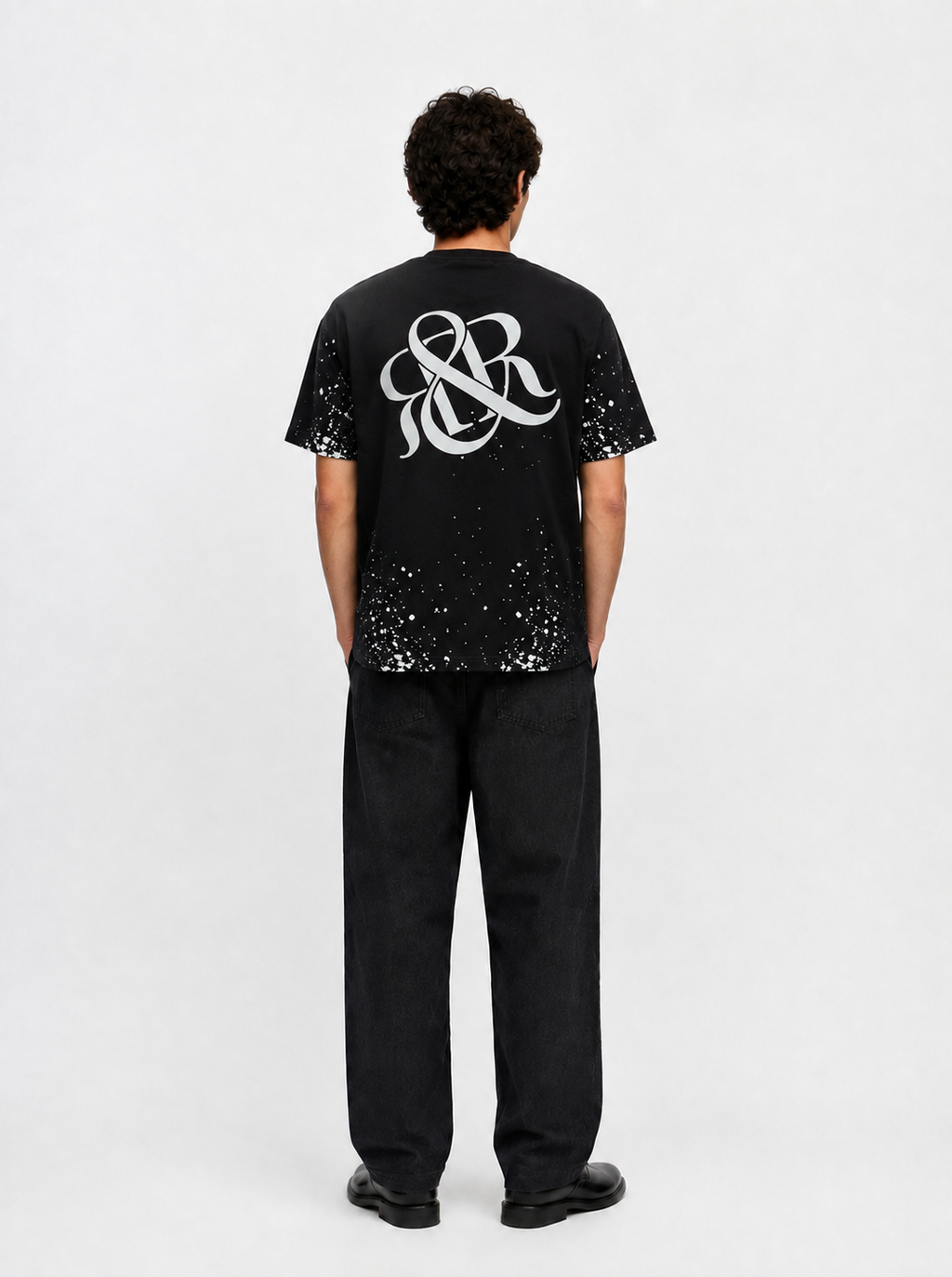 Rock Graphic T-Shirt with Distressed Paint Splatter Detail