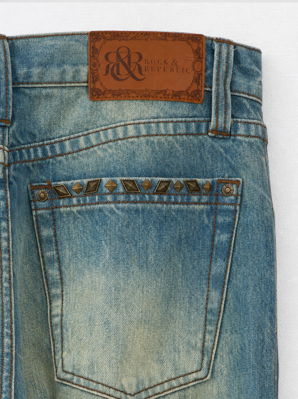 Baggy Jeans with Distressed Knee Details and Leather Back Patch