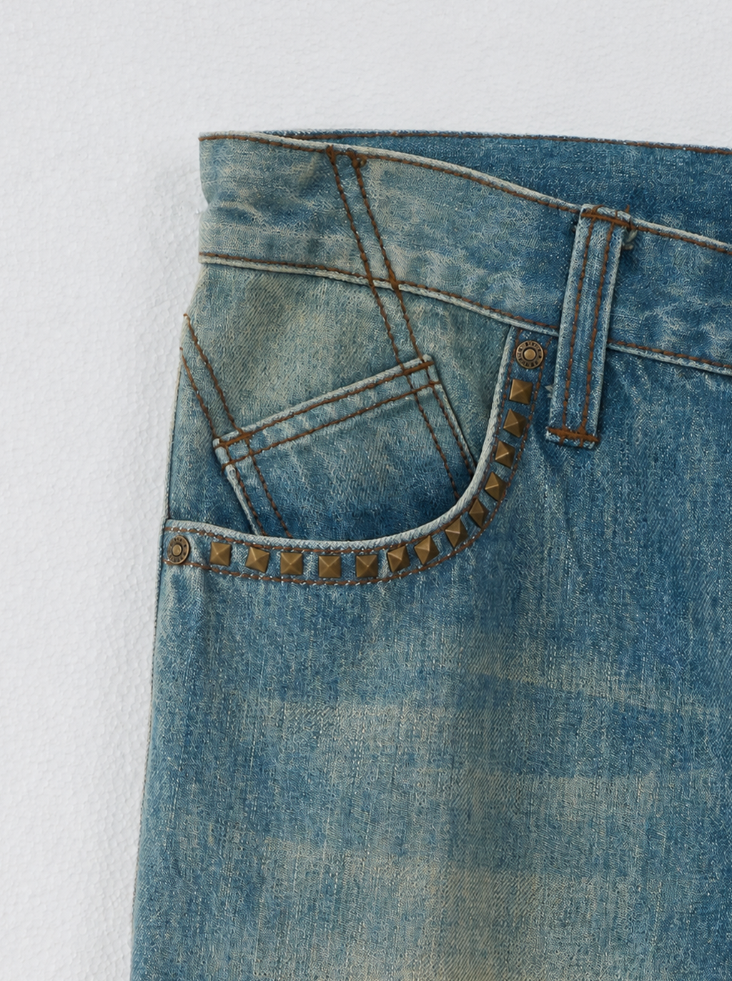 Baggy Jeans with Distressed Knee Details and Leather Back Patch