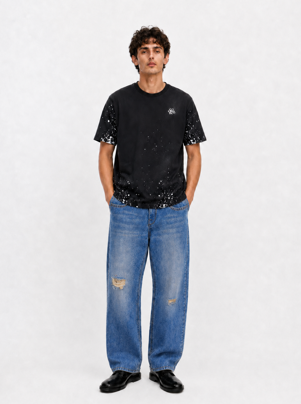 Baggy Jeans with Distressed Knee Details and Leather Back Patch