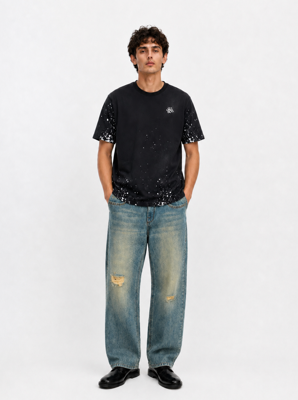 Baggy Jeans with Distressed Knee Details and Leather Back Patch