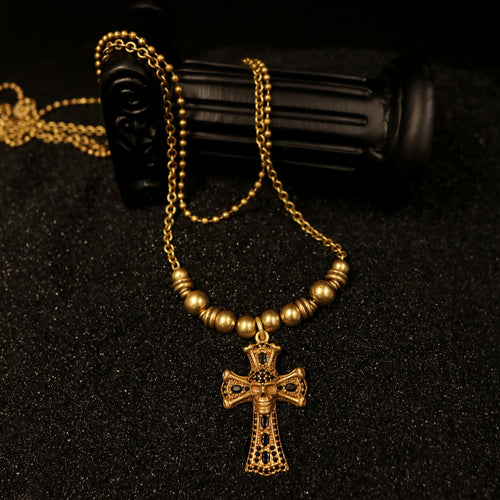 Display of Rock & Republic Beaded Cross Pendant Necklace in Beige with skull cross charm, black pavé, and metal beads.