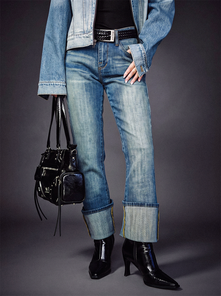 Front full view of Rock & Republic Kasandra bootcut jeans in VIP Status light wash featuring styled deep fold cuffs.