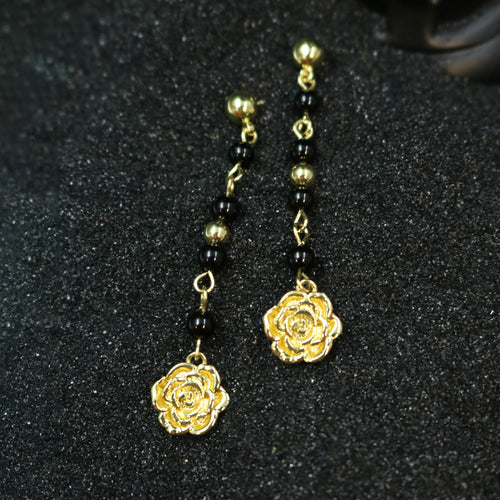 Rock & Republic Black Bead Rose Drop Earrings in Gold-tone copper with articulated black beads and sculpted rose motif.