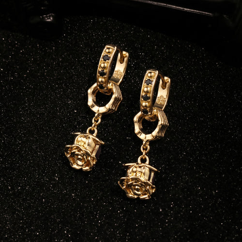 Top view of Rock & Republic Black Cubic Zirconia Rose Charm Hoop Earrings in Gold with studded huggie and 3D rose charm.