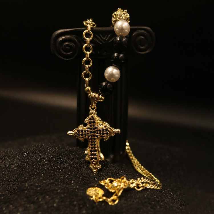 Rock & Republic embellished cross pendant necklace in Gold showing black pavé stone cross and mixed beaded chain link.