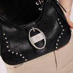 Rock & Republic Studded Ruched Hobo Shoulder Bag in Black PU close-up showing engraved RR metal buckle on hobo body.