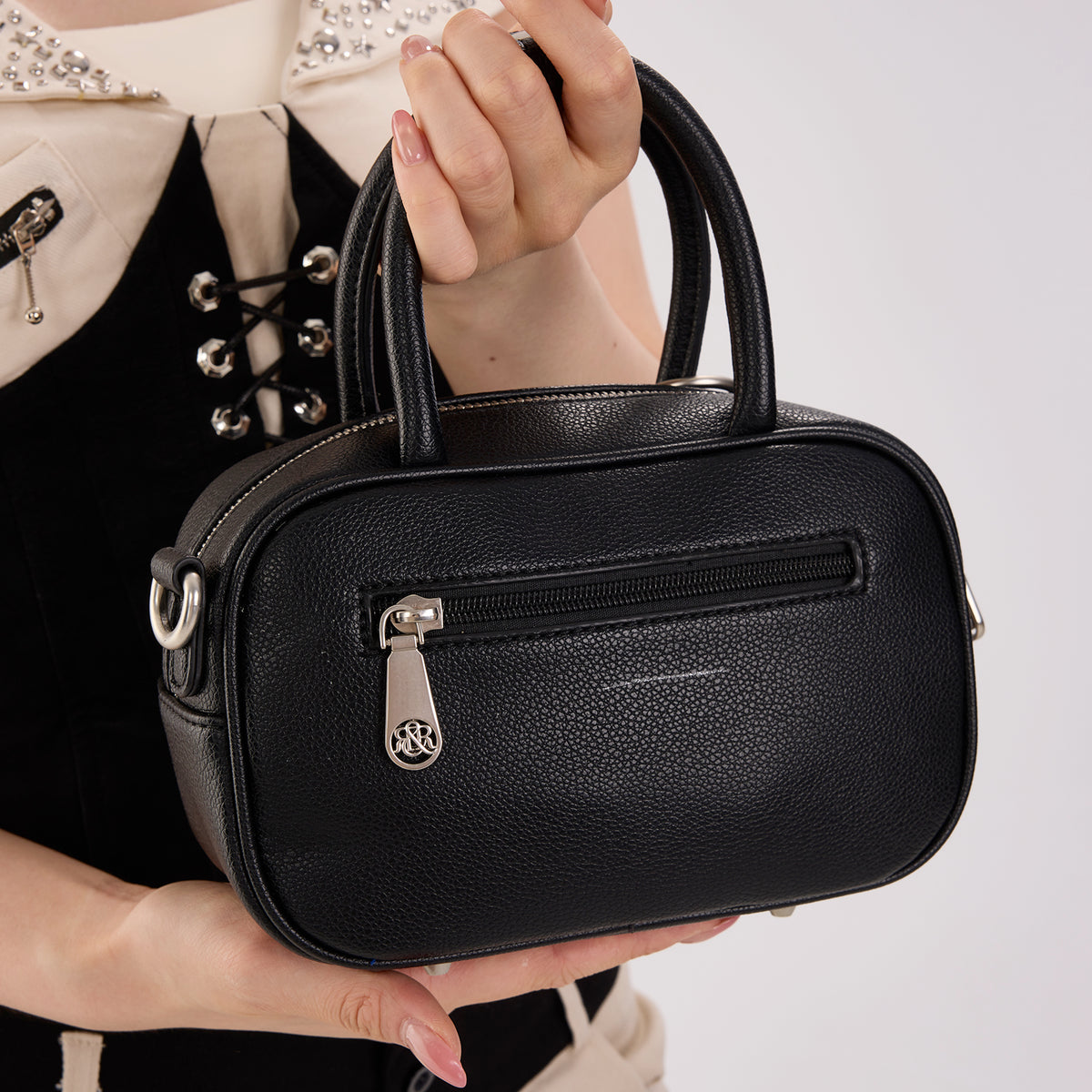 Rock & Republic Studded Logo Medallion Satchel Bag in Black PU back view showing clean structured satchel shape.