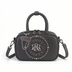 Rock & Republic Studded Logo Medallion Satchel Bag in Gray PU leather with medallion and satchel silhouette.