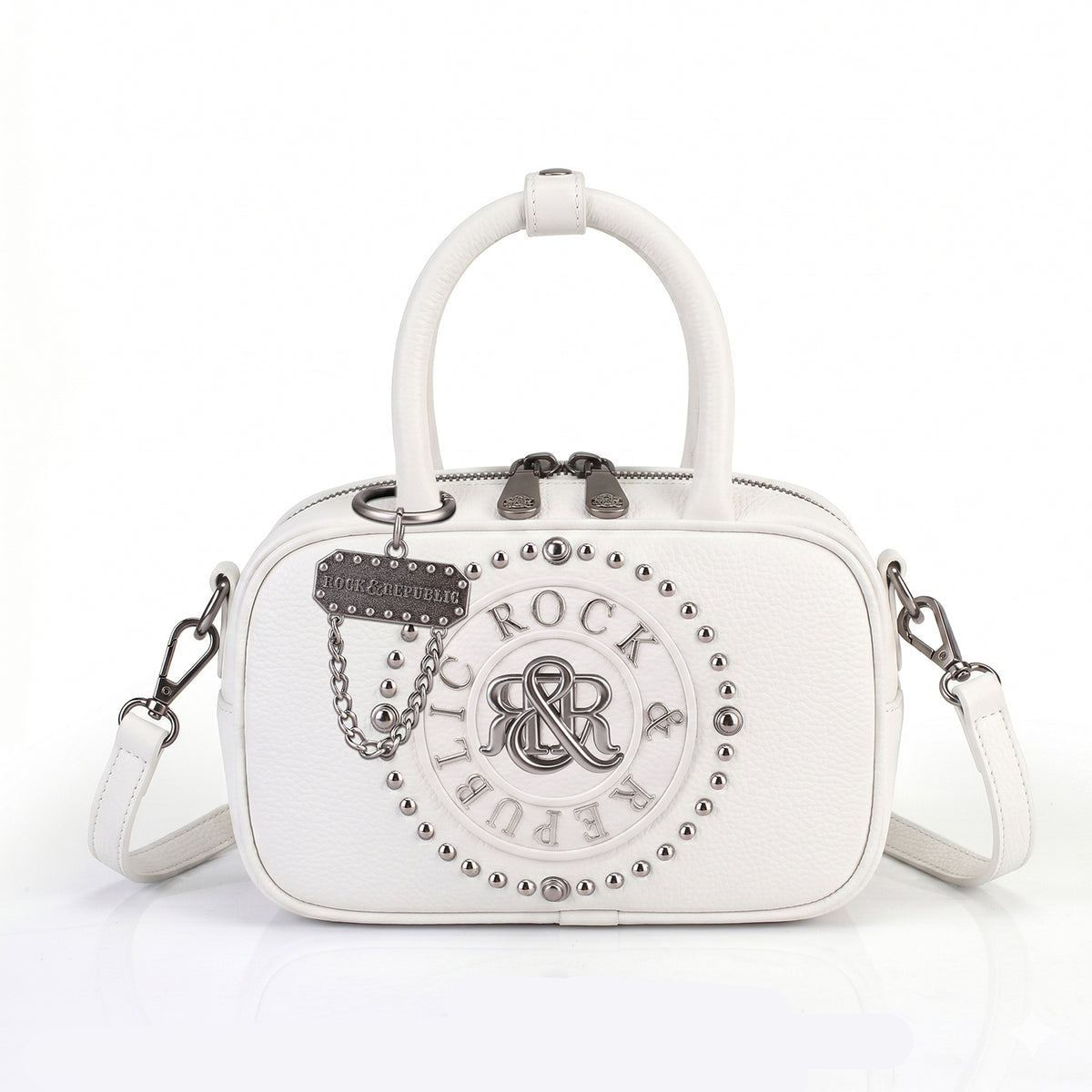 Rock & Republic Studded Logo Medallion Satchel Bag in White PU with medallion and structured satchel silhouette.