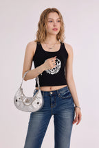 Rock & Republic Studded Crescent Chain Hobo Bag in Silver PU styled on model showing handheld crescent hobo profile.