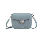 Rock & Republic Shield Lock Saddle Crossbody Bag in Light Blue PU with stud details and saddle crossbody silhouette.