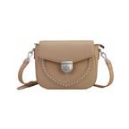 Rock & Republic Shield Lock Saddle Crossbody Bag in Tan PU leather with shield lock hardware and saddle crossbody shape.