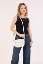 Rock & Republic Shield Lock Saddle Crossbody Bag in White PU styled on model showing its sleek saddle crossbody shape.