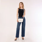 Rock & Republic Shield Lock Saddle Crossbody Bag in White PU worn on model showing classic saddle crossbody silhouette.